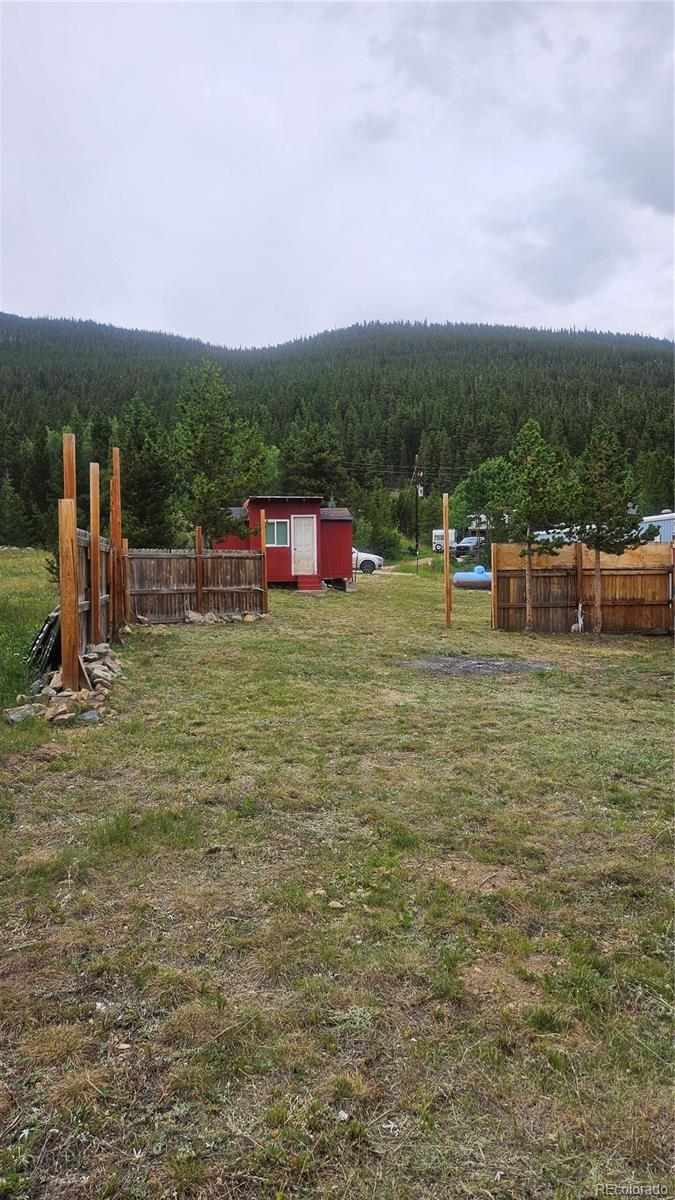 Little Creek Road Idaho Springs, CO 80452 - Photo 2 of 4 a view of a green field with sitting area