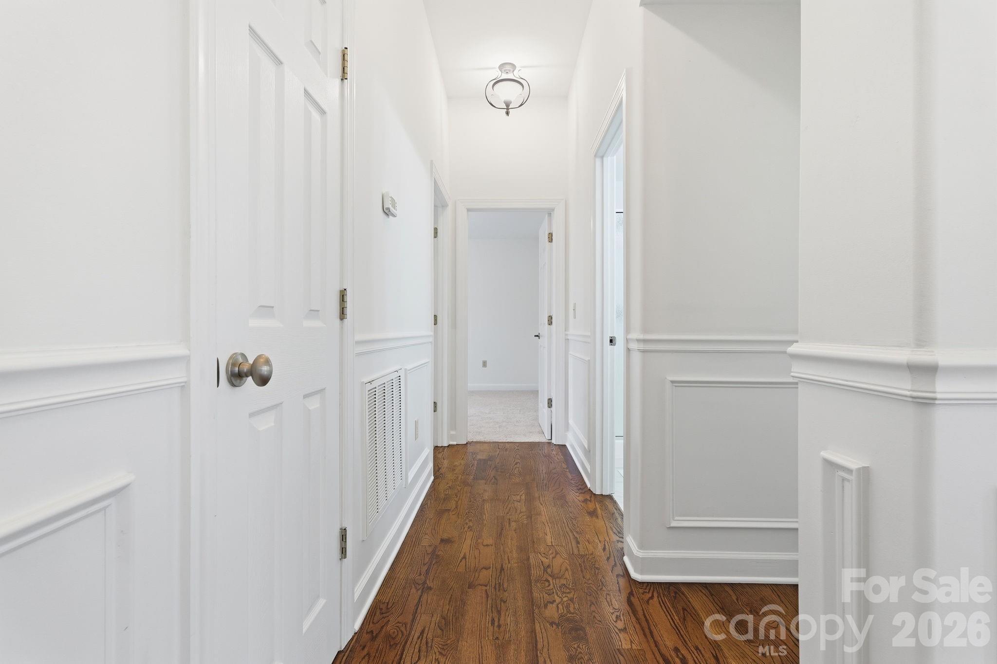 157 Byers Road Troutman, NC 28166 - Photo 14 of 32 a view of a hallway with wooden floor and entryway