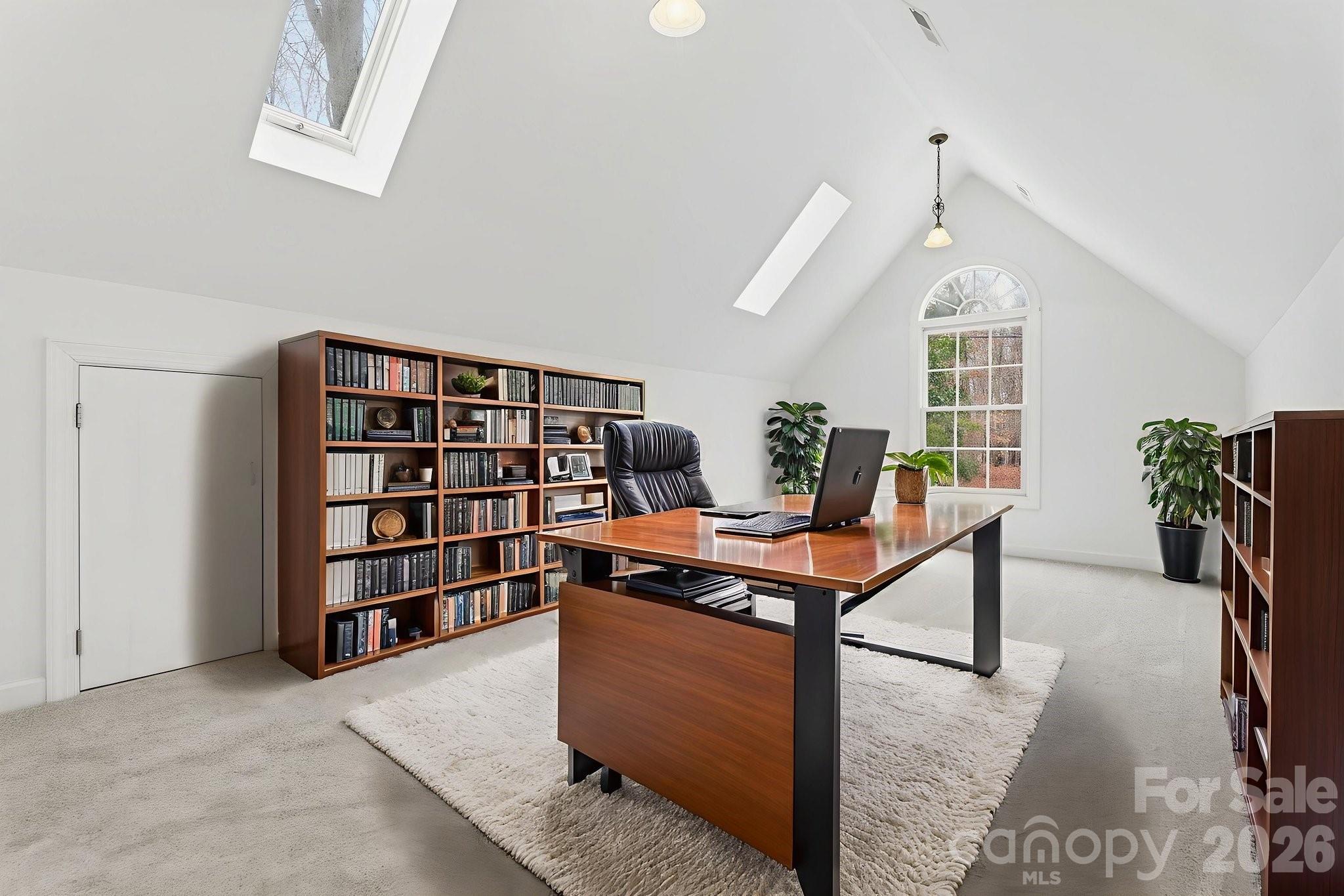 157 Byers Road Troutman, NC 28166 - Photo 22 of 32 a room with furniture and a book shelf