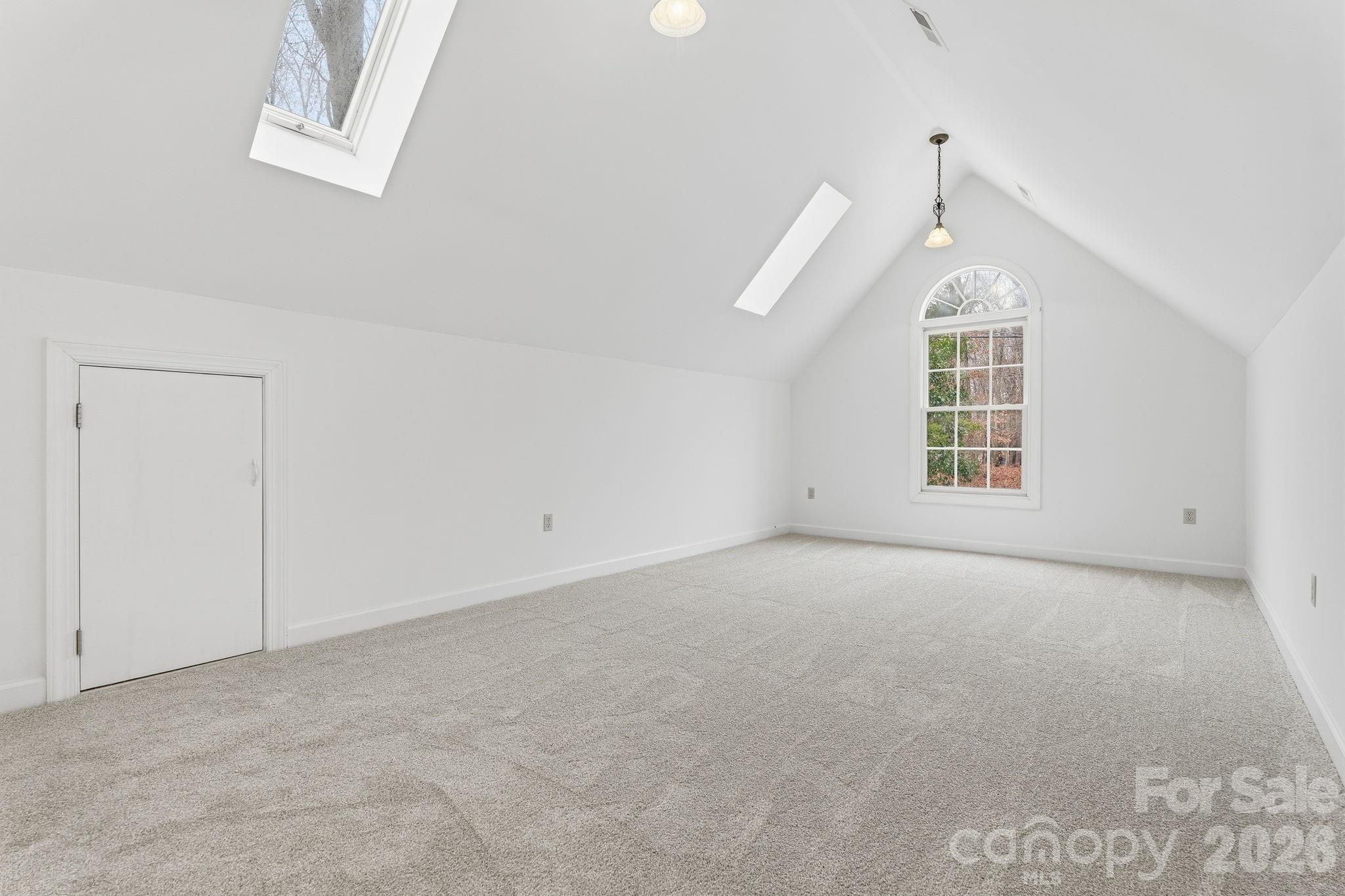 157 Byers Road Troutman, NC 28166 - Photo 23 of 32 an empty room with windows and ceiling fan