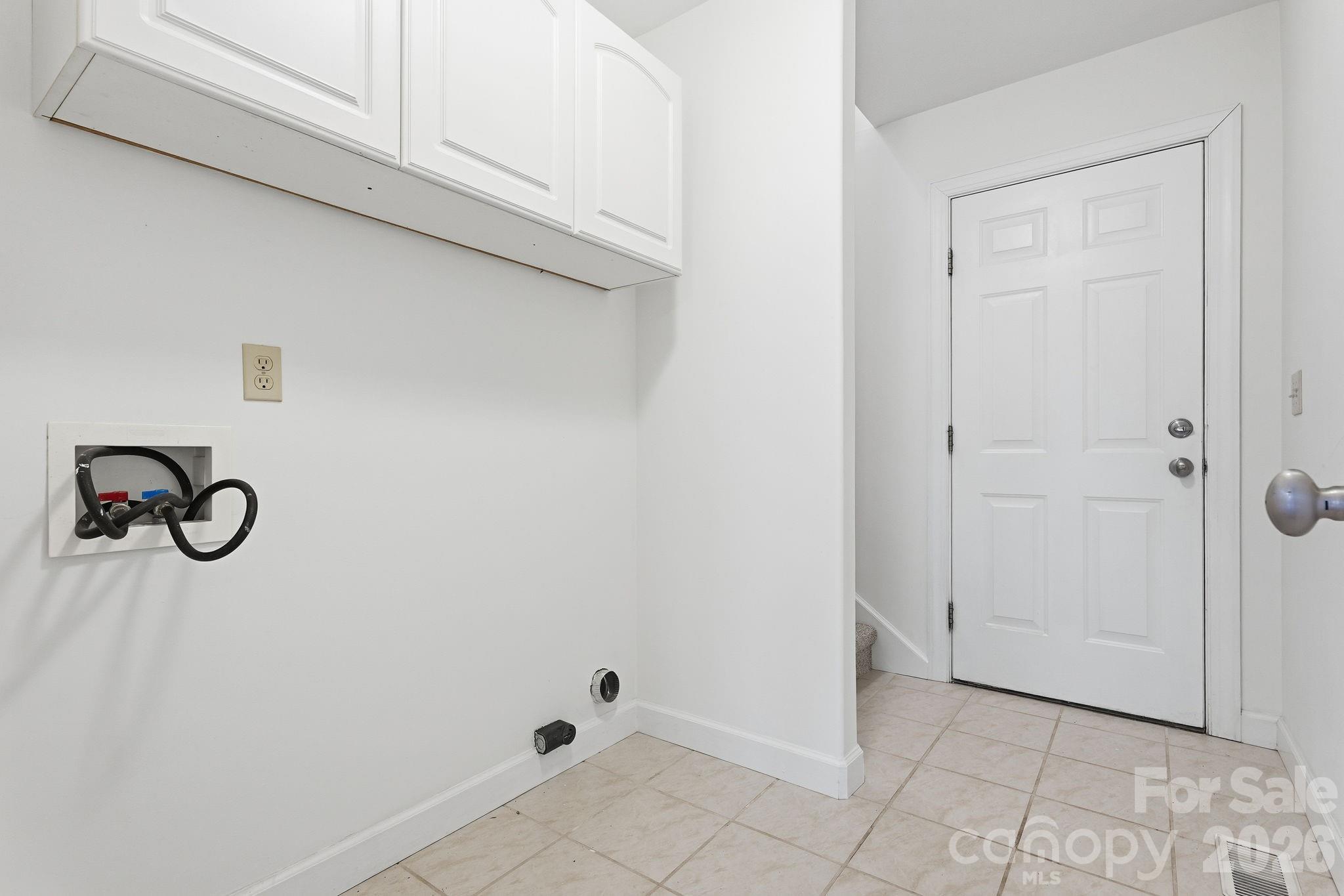 157 Byers Road Troutman, NC 28166 - Photo 24 of 32 a bathroom with a glass shower door