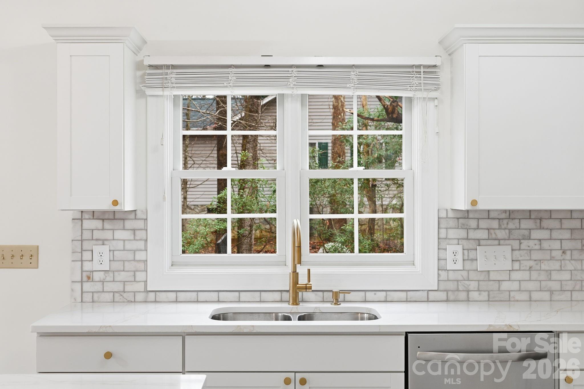 157 Byers Road Troutman, NC 28166 - Photo 7 of 32 a bathroom with a sink and a window