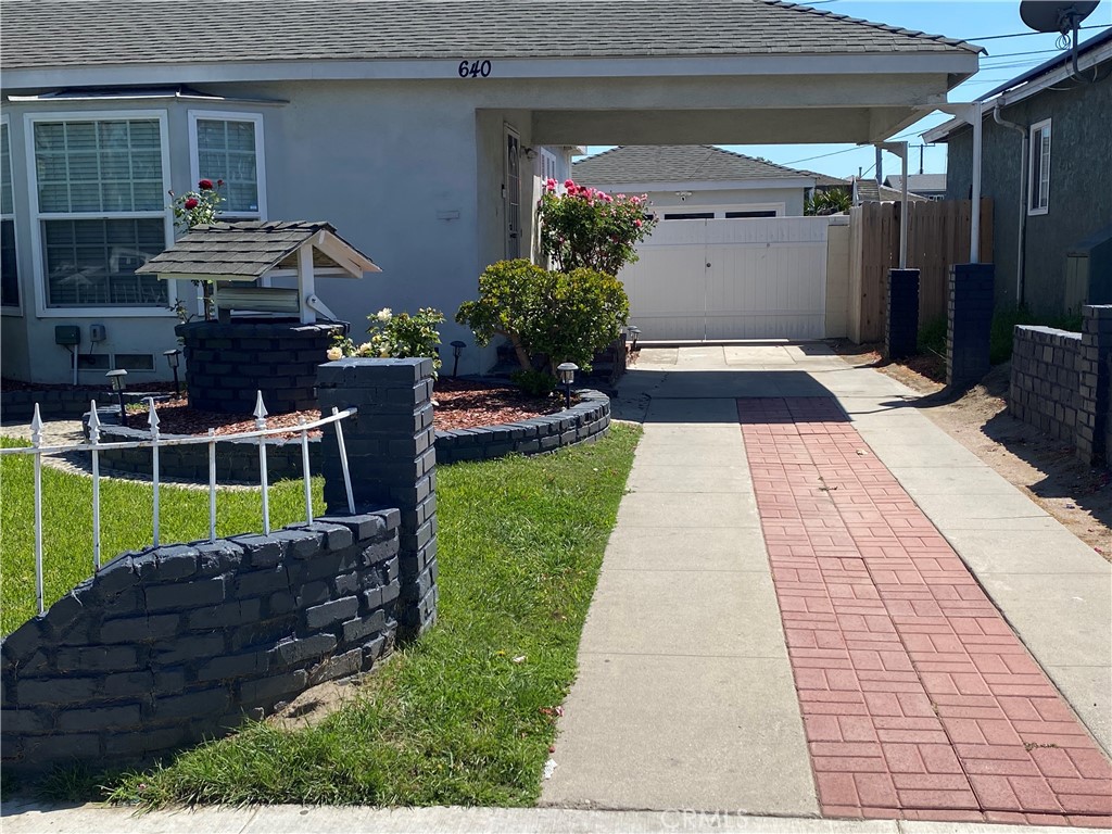 640 East Harding Street Long Beach, CA 90805 - Photo 3 of 3 a view of house with a yard and potted plants