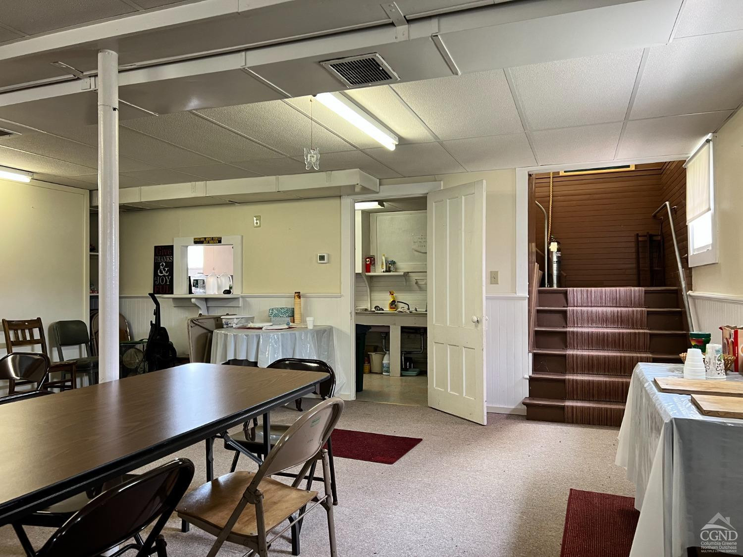 1781 Highway 23 Copake, NY 12521 - Photo 11 of 24 a kitchen with a table chairs refrigerator and cabinets