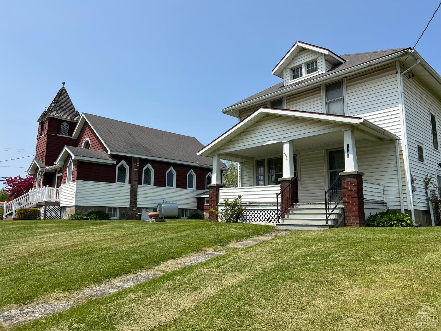 1781 Highway 23 Copake, NY 12521 - Photo 2 of 24 a front view of a house with a garden