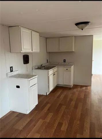 a kitchen with stainless steel appliances a white cabinets and a sink