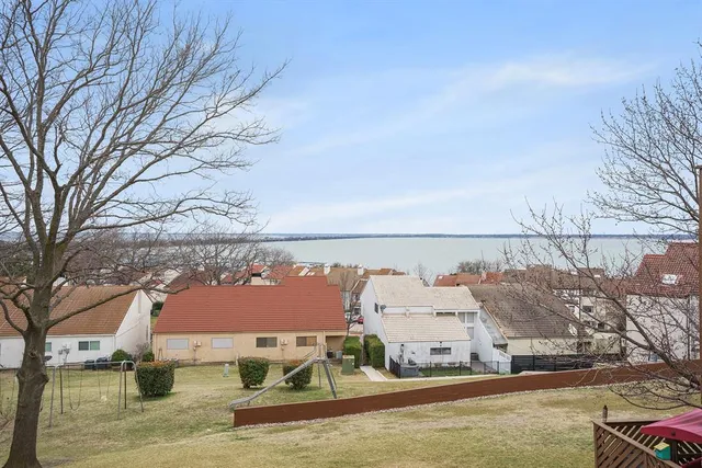 a view of houses with a road