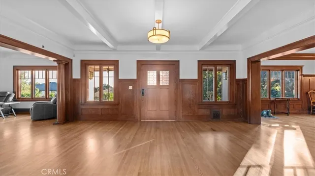 a view of livingroom with furniture wooden floor and windows
