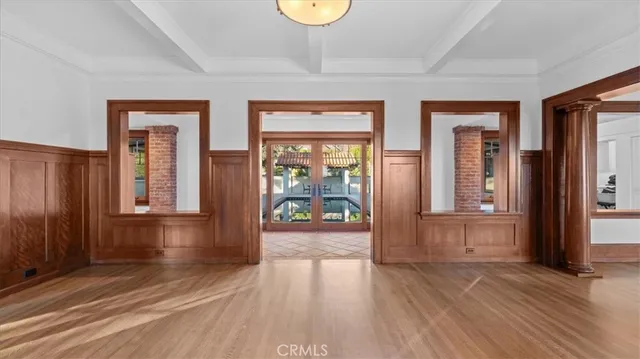 a view of an entryway with wooden floor