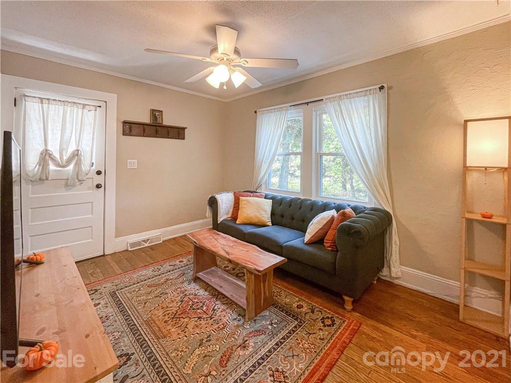 1585 County Road Waynesville, NC 28785 - Photo 3 of 9 a living room with furniture and a chandelier