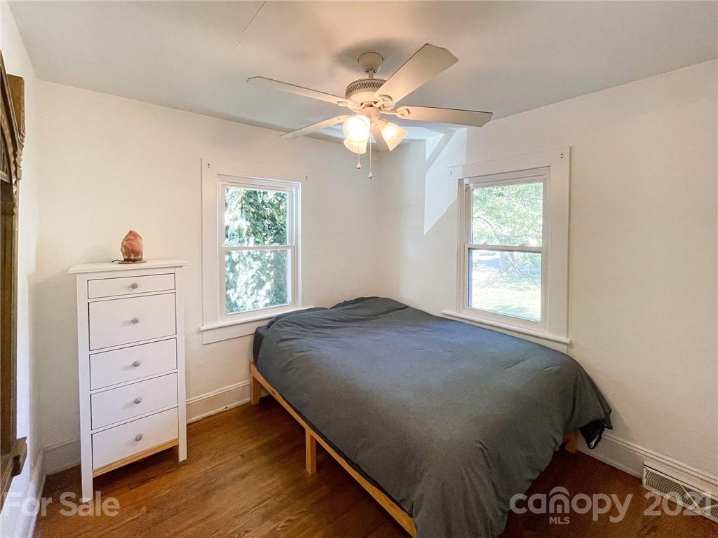 1585 County Road Waynesville, NC 28785 - Photo 5 of 9 a bedroom with a bed and a dresser