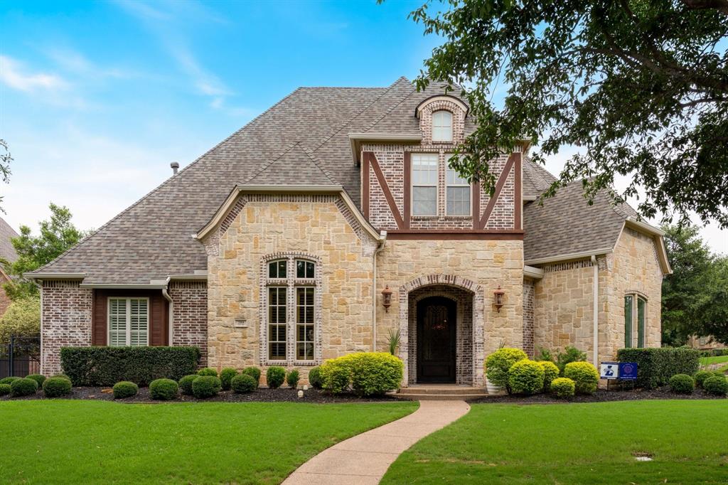 2101 Vail Road Southlake, TX 76092 - Photo 4 of 40 a front view of a house with garden