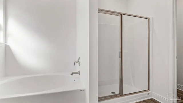 a view of an empty walk in closet with empty racks