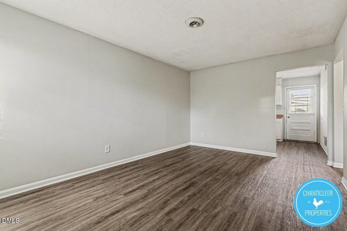 115 Florence Street, Unit 13 Graham, NC 27253 - Photo 6 of 29 a view of a room with wooden floor