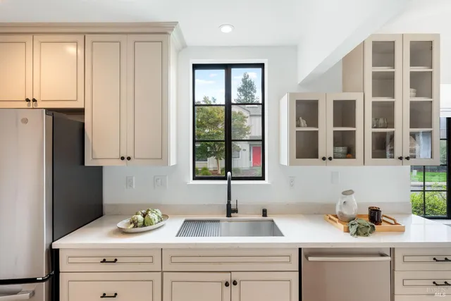a kitchen with a sink and cabinets
