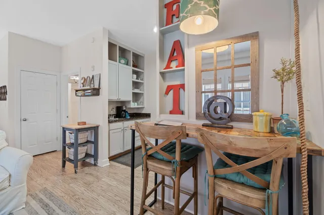 a view of a dining room with furniture and a window