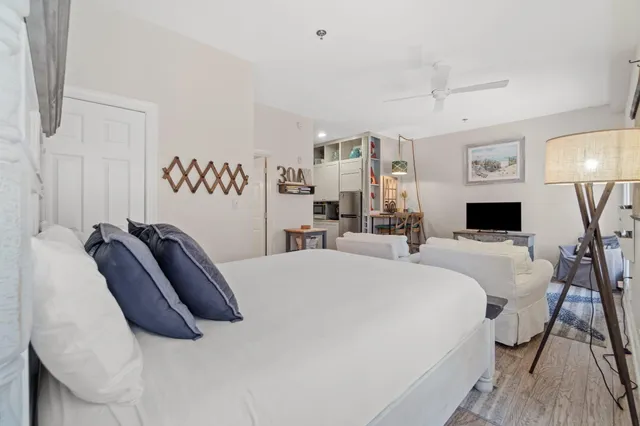 a bedroom with a bed and a table