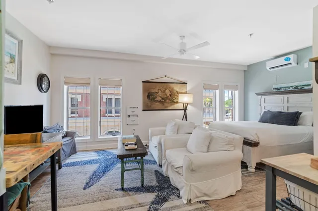 a living room with furniture rug and window