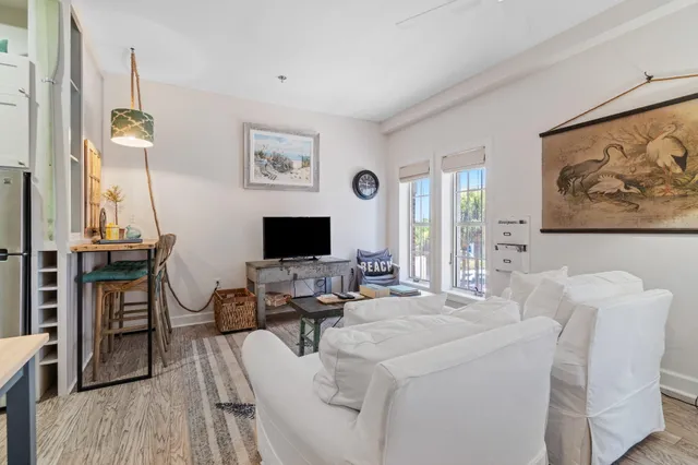 a view of a livingroom with workspace and a couch