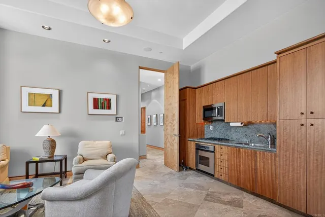 a kitchen with stainless steel appliances granite countertop a sink and cabinets