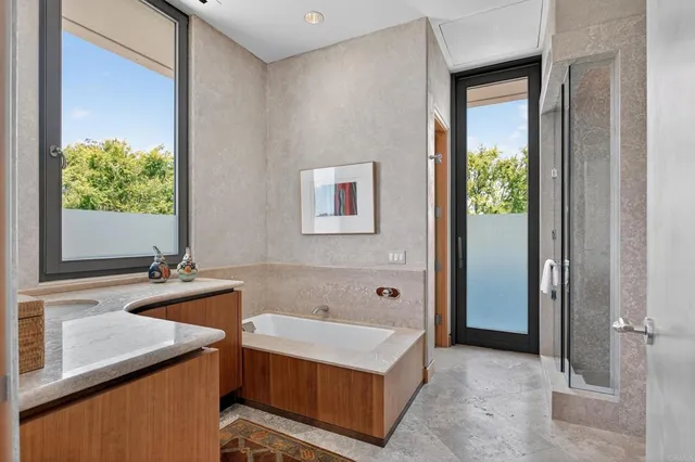 a bath room with a sink and a mirror