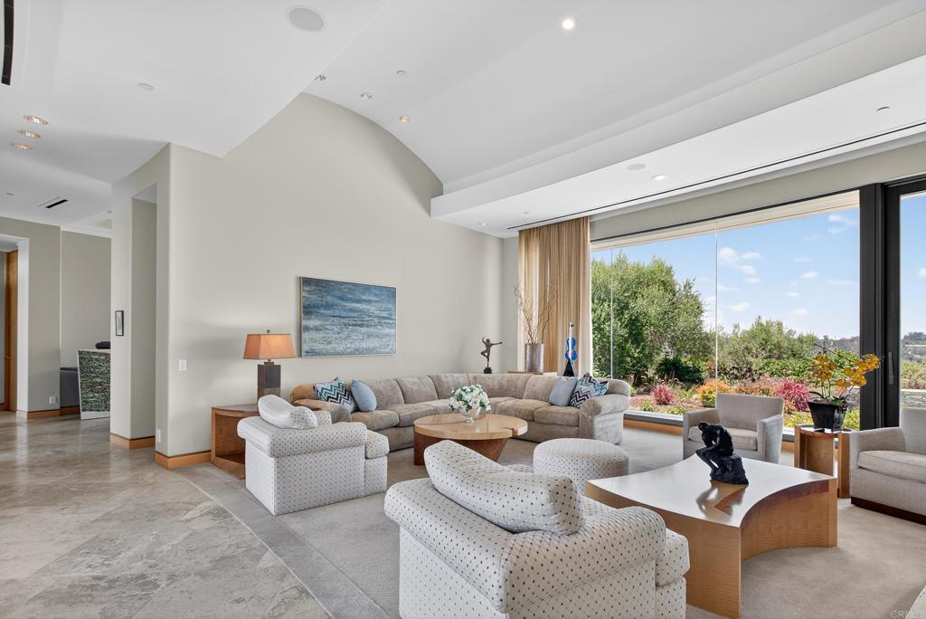 17534 Los Morros Rancho Santa Fe, CA 92067 - Photo 25 of 40 a living room with furniture and a large window