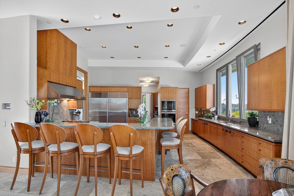 17534 Los Morros Rancho Santa Fe, CA 92067 - Photo 26 of 40 a dining room with furniture and a large window