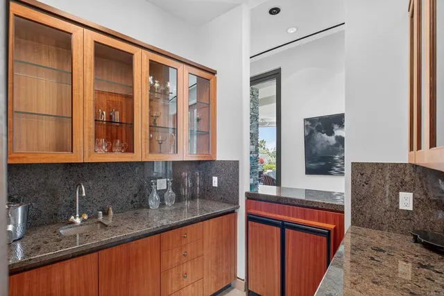 a kitchen with granite countertop a sink and a window