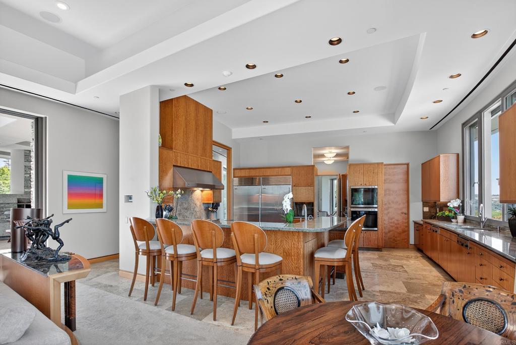 17534 Los Morros Rancho Santa Fe, CA 92067 - Photo 29 of 40 a view of a dining room with furniture
