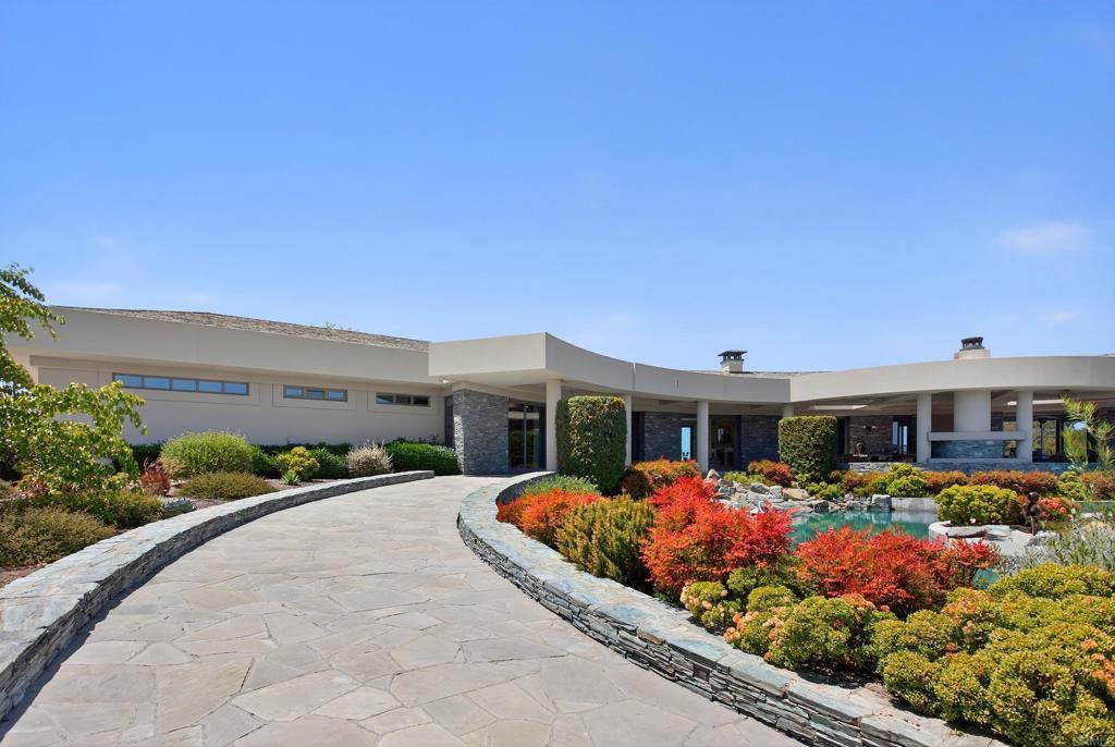 17534 Los Morros Rancho Santa Fe, CA 92067 - Photo 35 of 40 a front view of a house with a yard