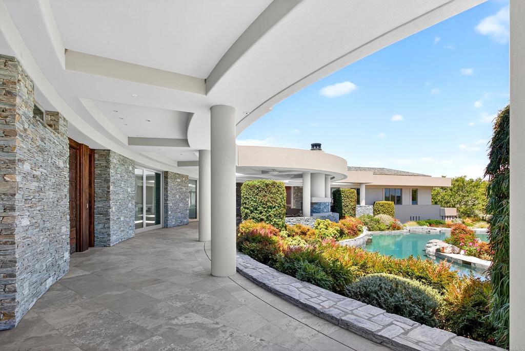17534 Los Morros Rancho Santa Fe, CA 92067 - Photo 37 of 40 a view of a porch with furniture and front view of a house