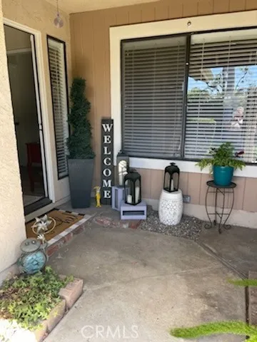 a view of a chairs and table in a back yard