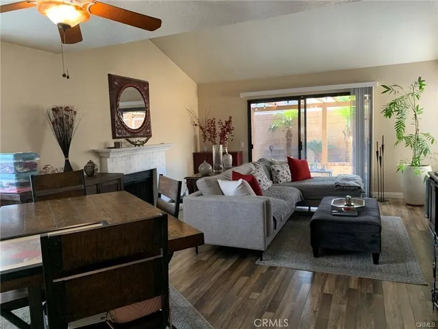 a living room with furniture and a mirror
