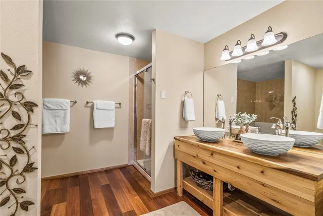 a bathroom with a sink a light fixture and a mirror