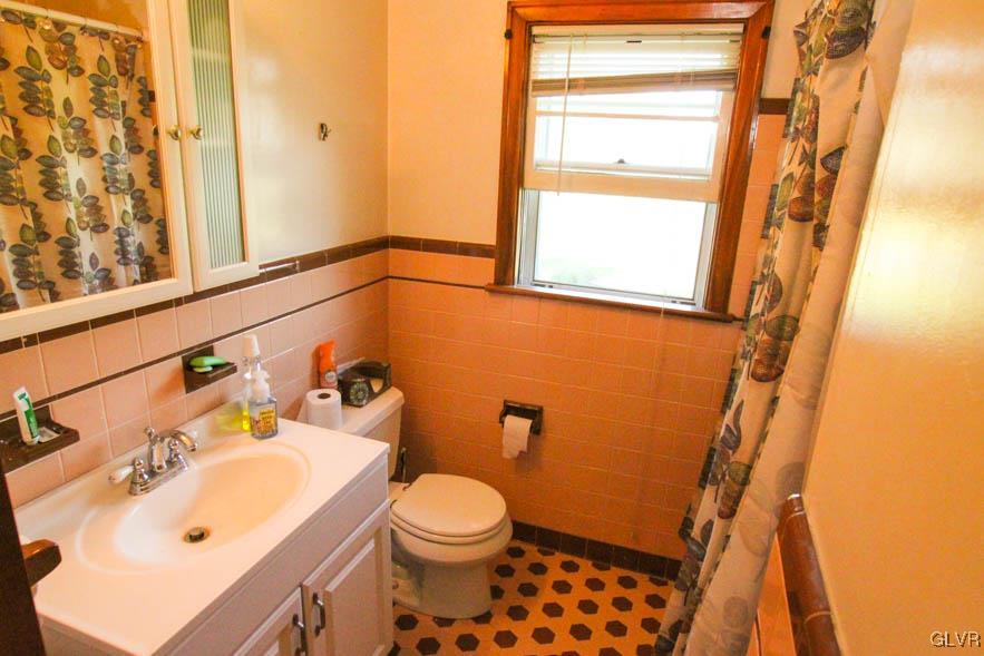 5916 Old Carriage Road Bath, PA 18014 - Photo 12 of 28 a bathroom with a sink toilet and shower