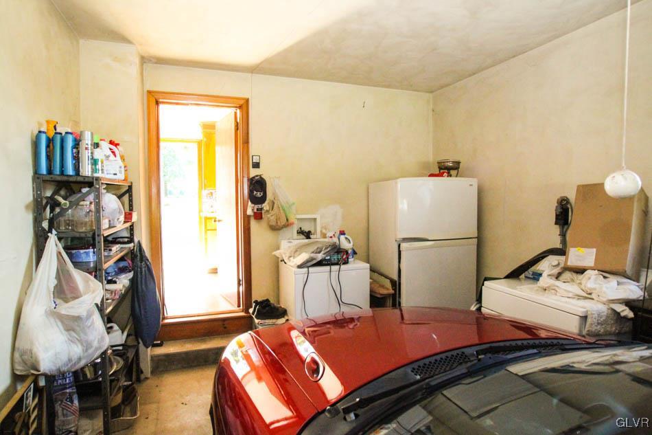 5916 Old Carriage Road Bath, PA 18014 - Photo 20 of 28 a room with a bed and a refrigerator