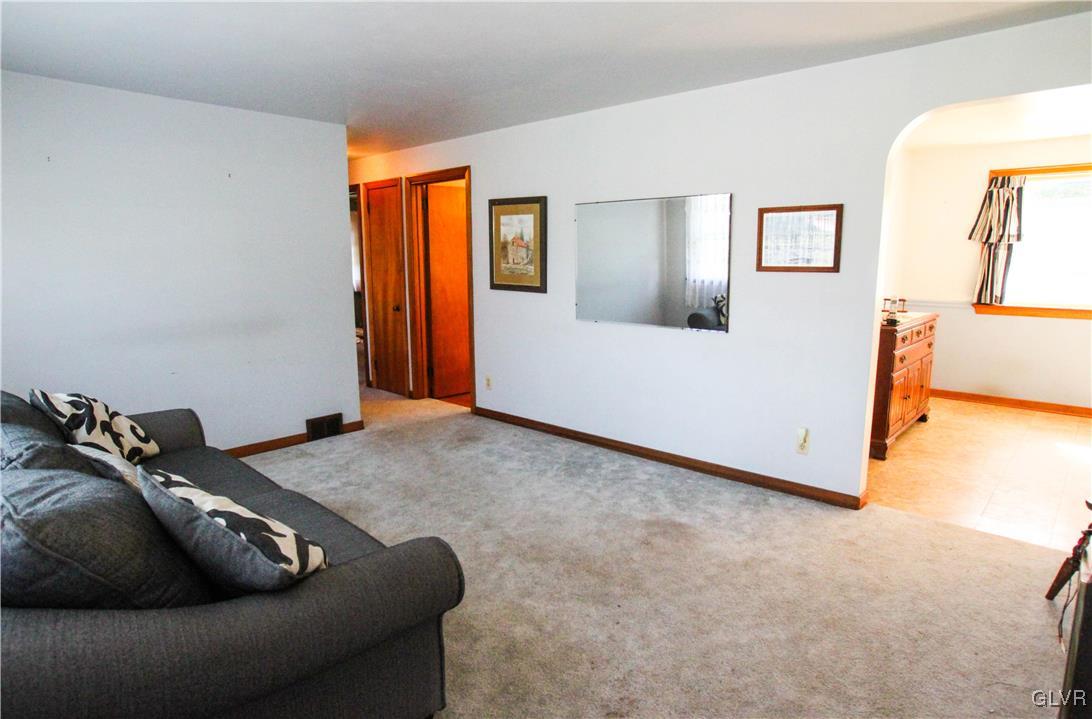 5916 Old Carriage Road Bath, PA 18014 - Photo 4 of 28 a living room with furniture and a wooden floor