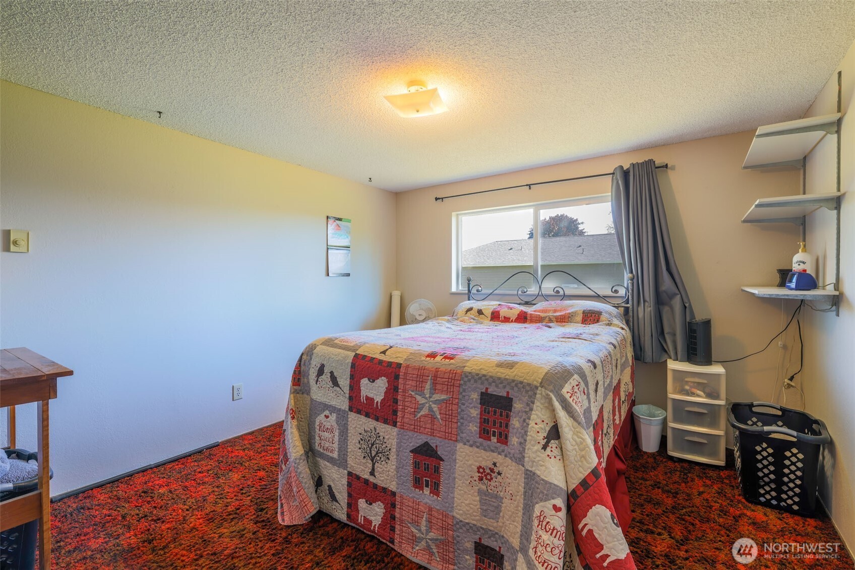 209 West Scott Street Aberdeen, WA 98520 - Photo 11 of 16 a bedroom with a bed and a window