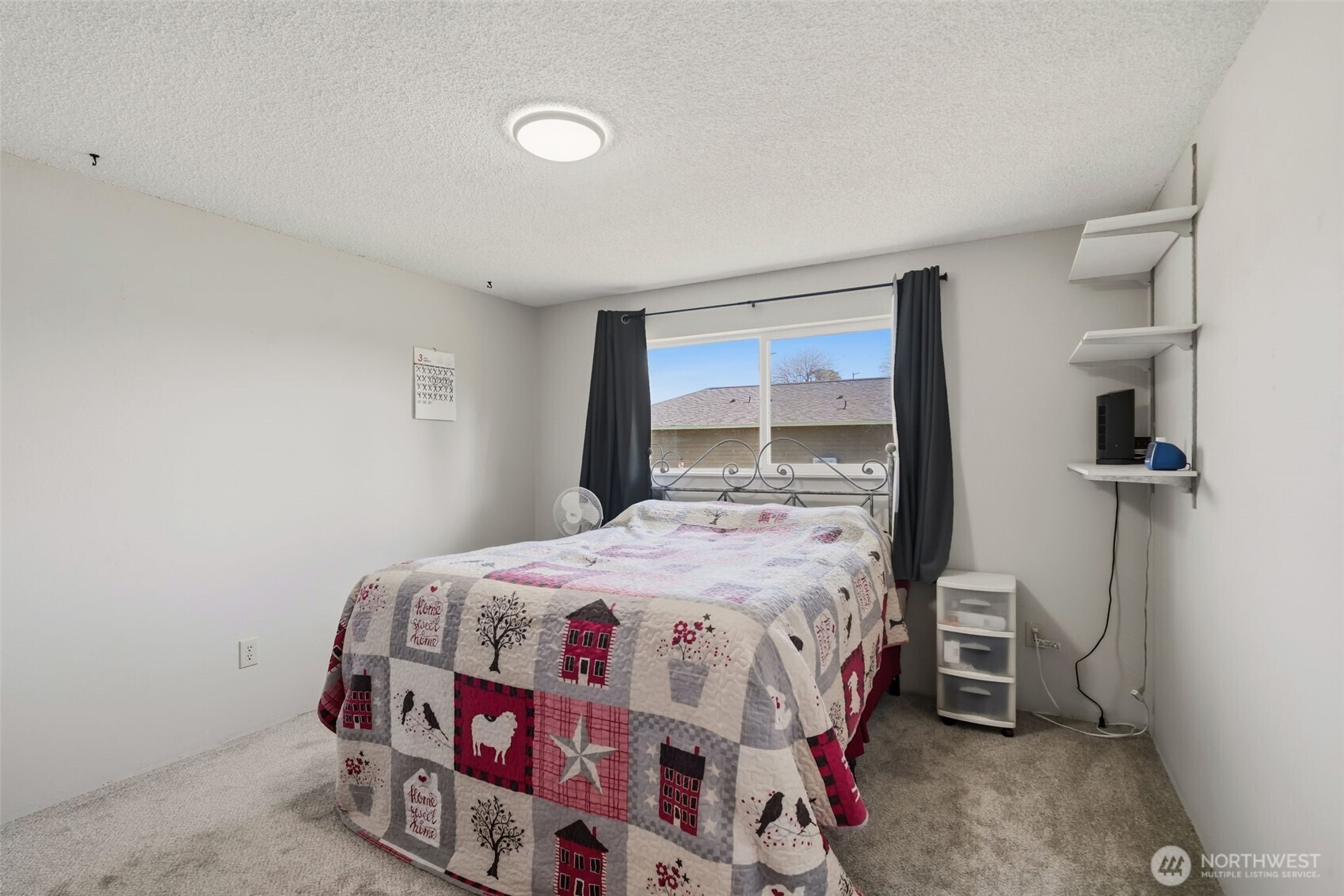 209 West Scott Street Aberdeen, WA 98520 - Photo 12 of 26 a bedroom with a bed a mirror and a window