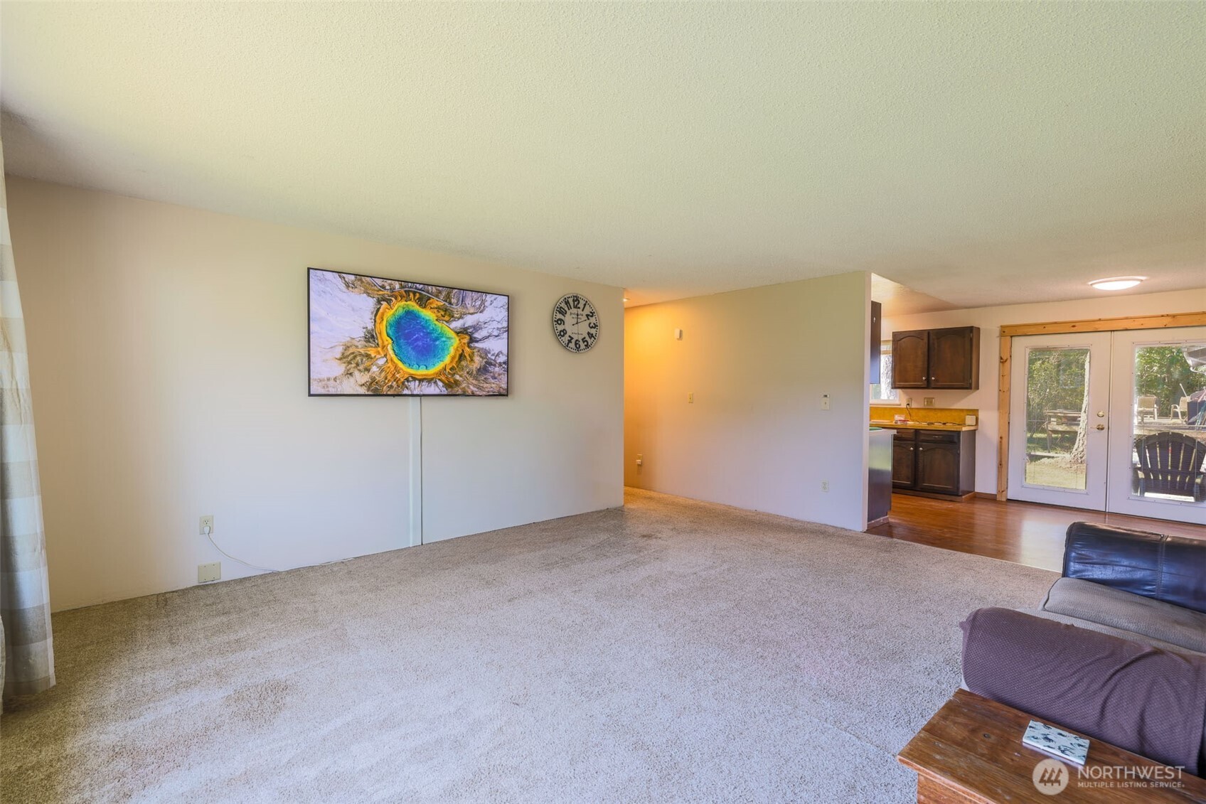 209 West Scott Street Aberdeen, WA 98520 - Photo 4 of 16 an empty room with furniture and wooden floor
