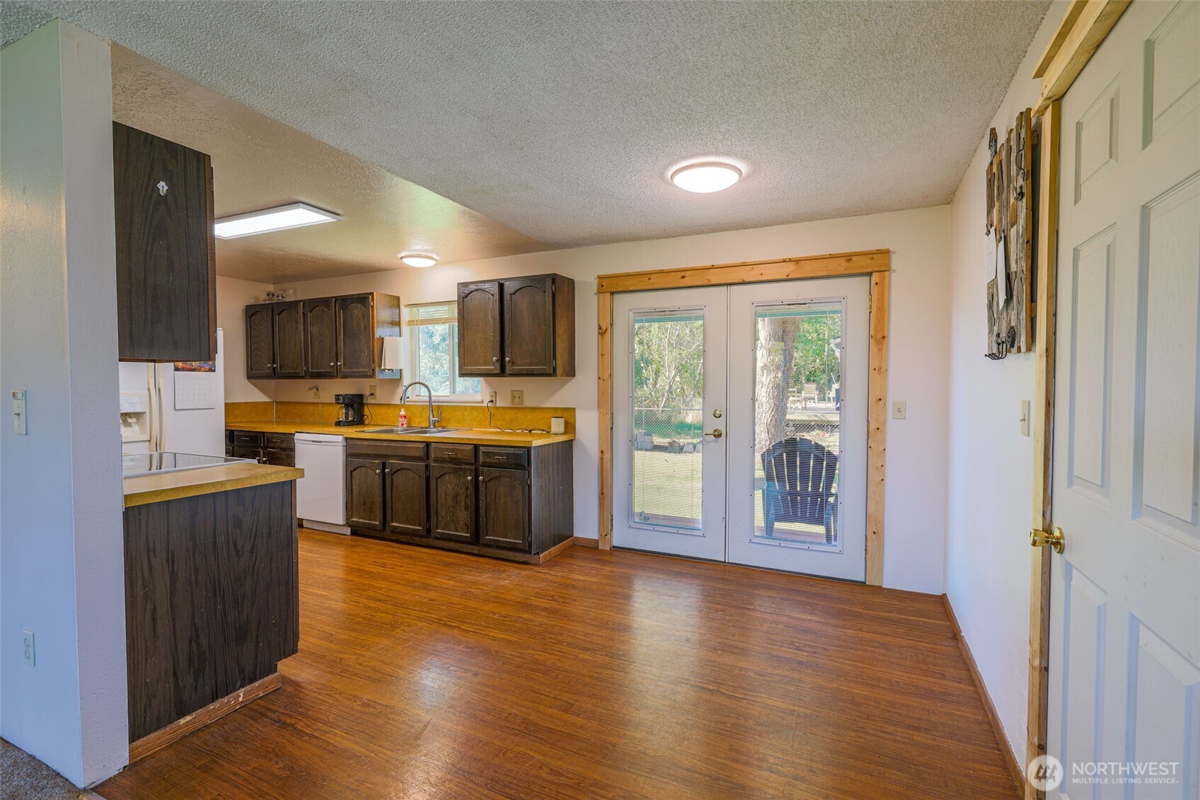 209 West Scott Street Aberdeen, WA 98520 - Photo 6 of 16 a kitchen with stainless steel appliances a stove top oven a sink a refrigerator a window