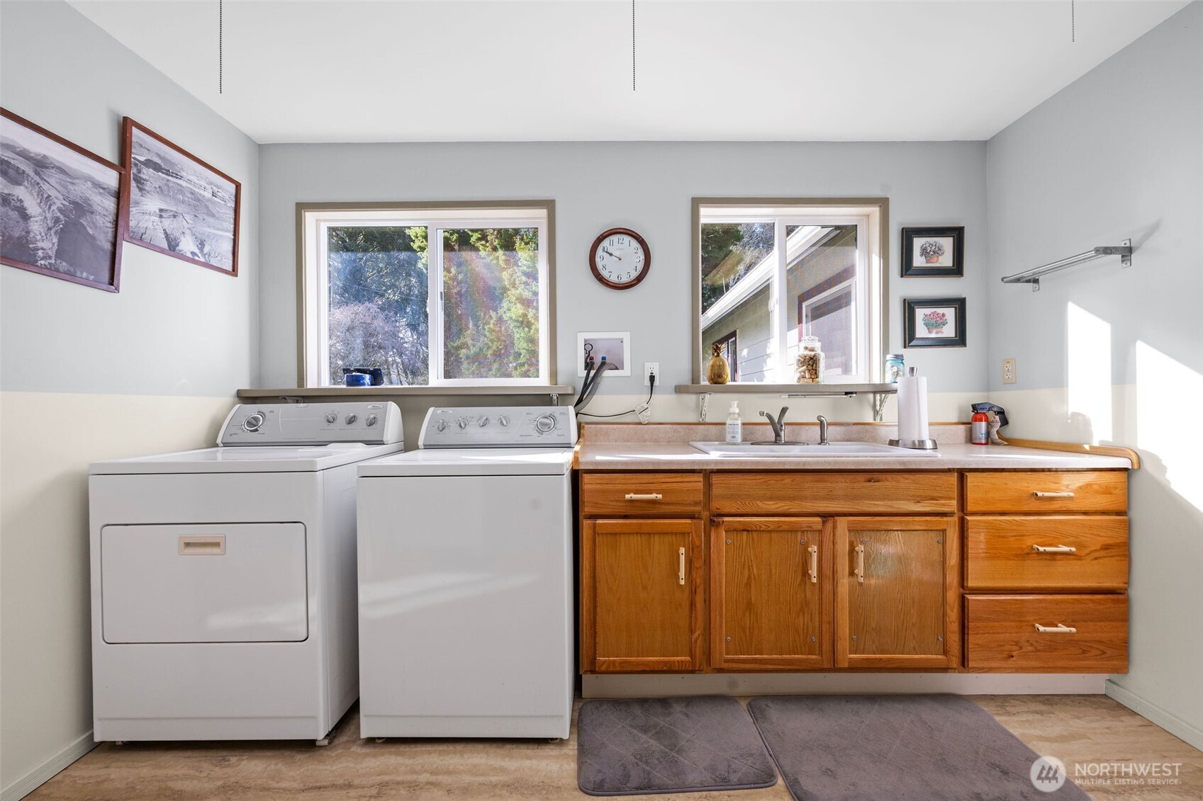471 Barr Road Grays River, WA 98643 - Photo 23 of 40 a bathroom with a granite countertop sink mirror and window