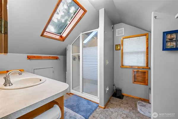 a bathroom with a sink and mirror
