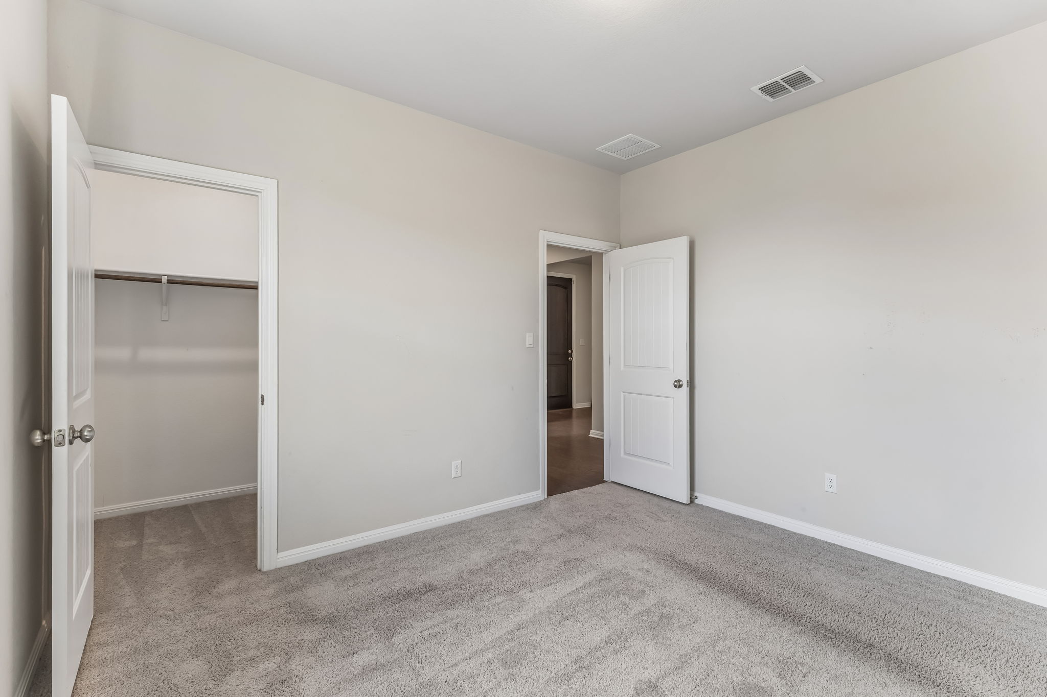 4009 Milano River Road Hutto, TX 78634 - Photo 32 of 40 Plush wall-to-wall carpeting and simple baseboards define this versatile space.