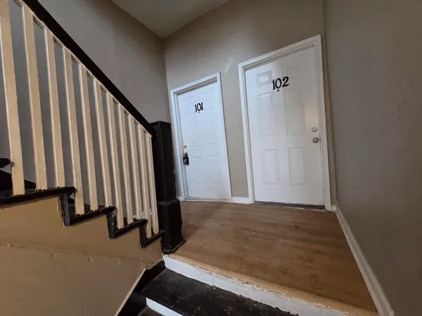 a kitchen with wooden cabinets and white appliances