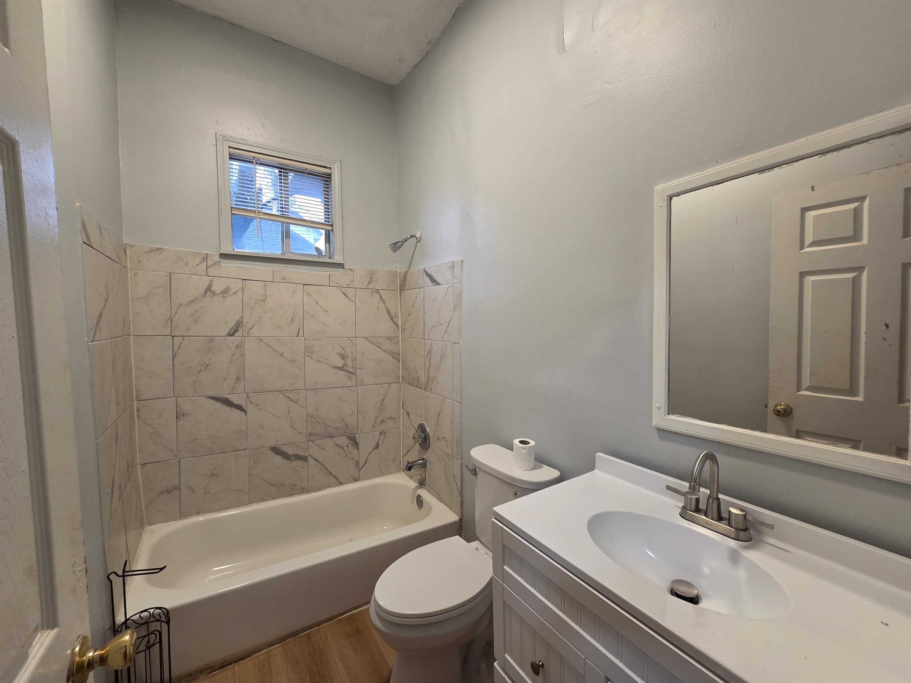 993 Oakview Street, Unit 101 Memphis, TN 38114 - Photo 13 of 14 a bathroom with a sink a toilet and bathtub