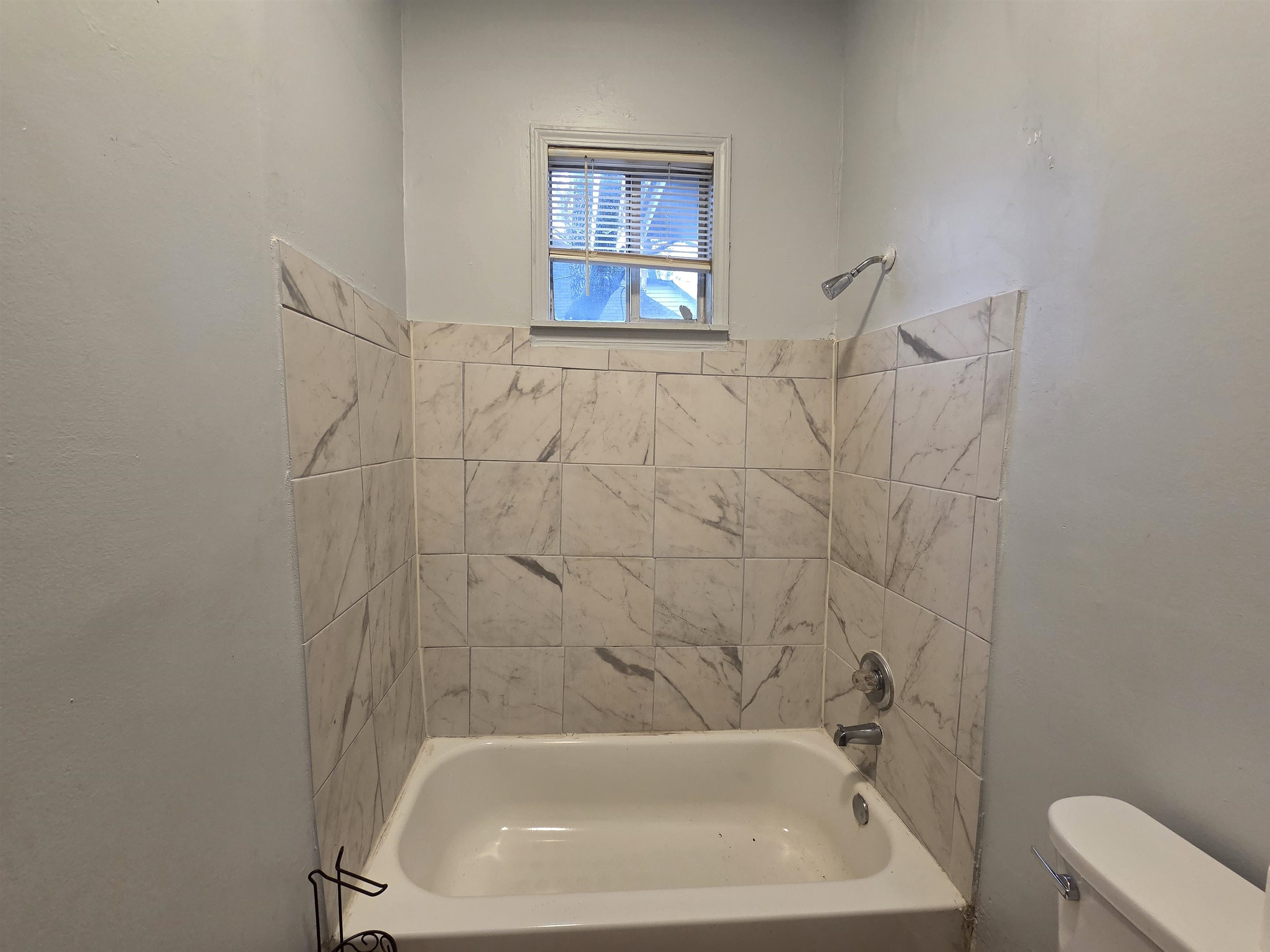993 Oakview Street, Unit 101 Memphis, TN 38114 - Photo 14 of 14 a bathroom with a sink and bathtub