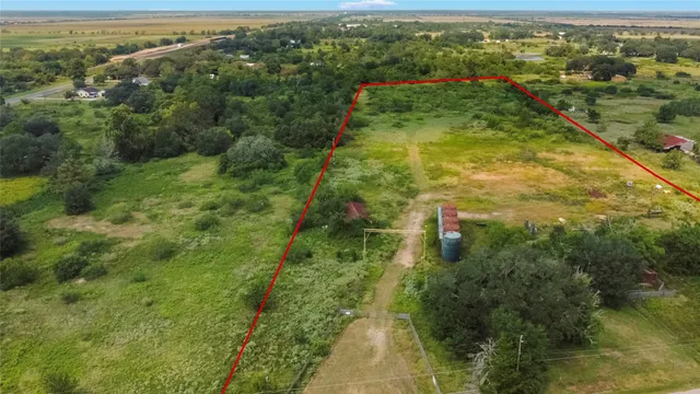 a view of a forest with a houses