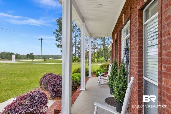 24541 Baldwin Beach Expressway Robertsdale, AL 36567 - Photo 5 of 51 View of patio featuring covered porch