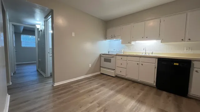 a kitchen with sink and cabinets